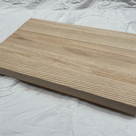 Wooden chopping board on a white background