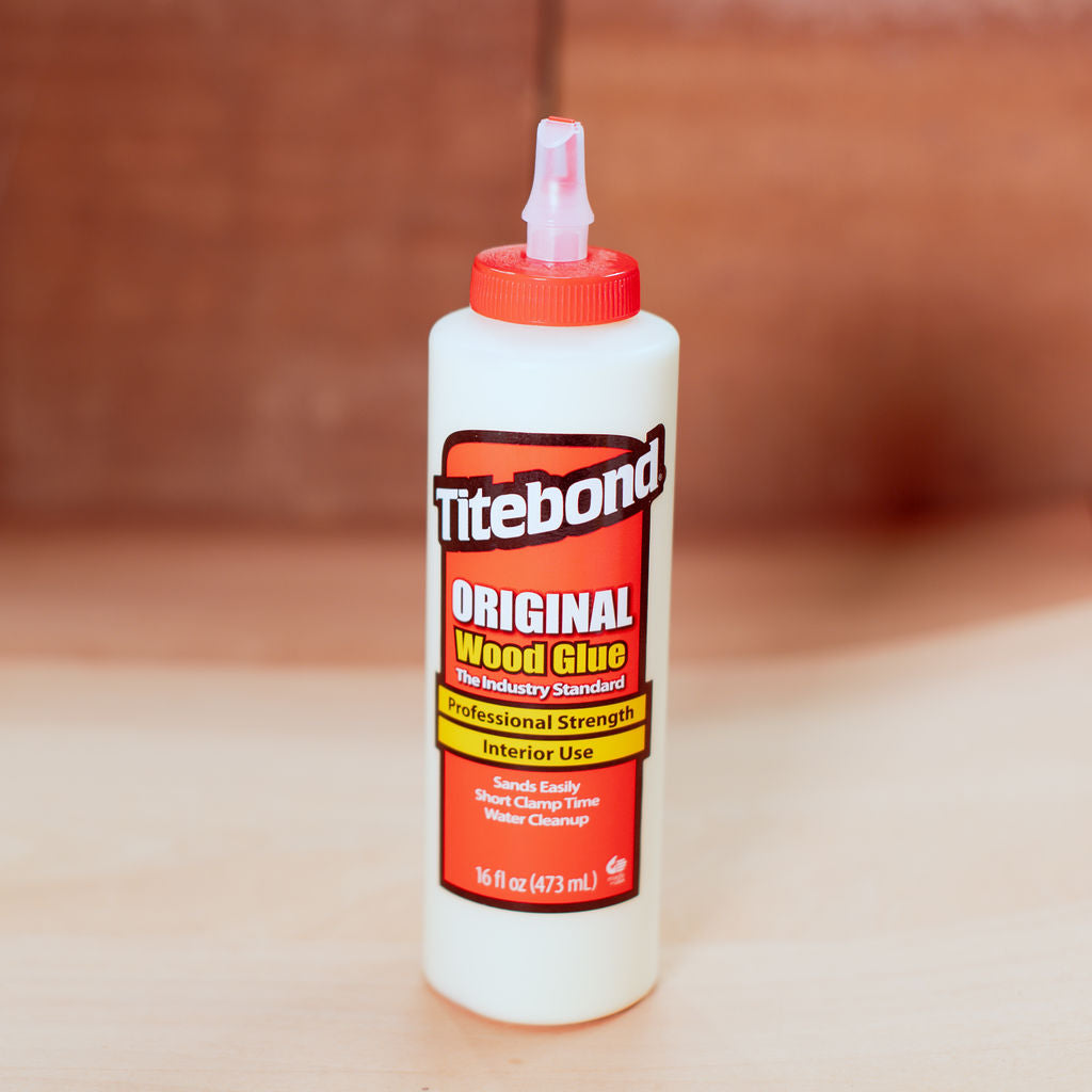 437ml Titebond Original Wood Glue bottle on a wooden surface